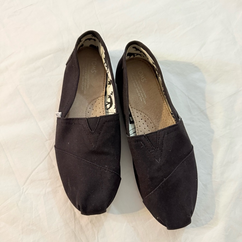 Toms Black Canvas Slip-Ons with Animal Print Lining
